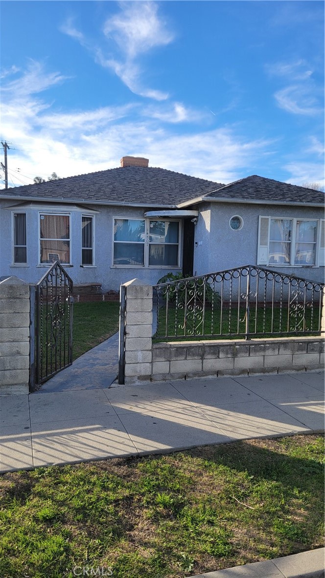 14807 South White Avenue Compton, CA 90221 - Photo 2 of 5 a front view of a house with garden