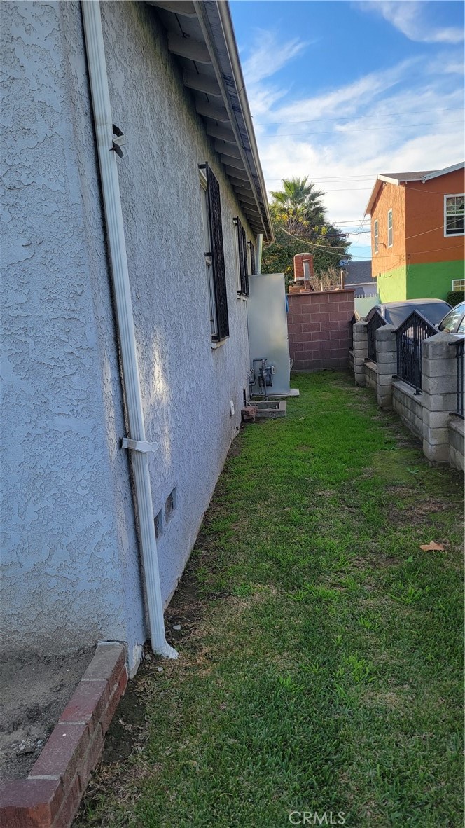14807 South White Avenue Compton, CA 90221 - Photo 4 of 5 a backyard of a house with lots of green space