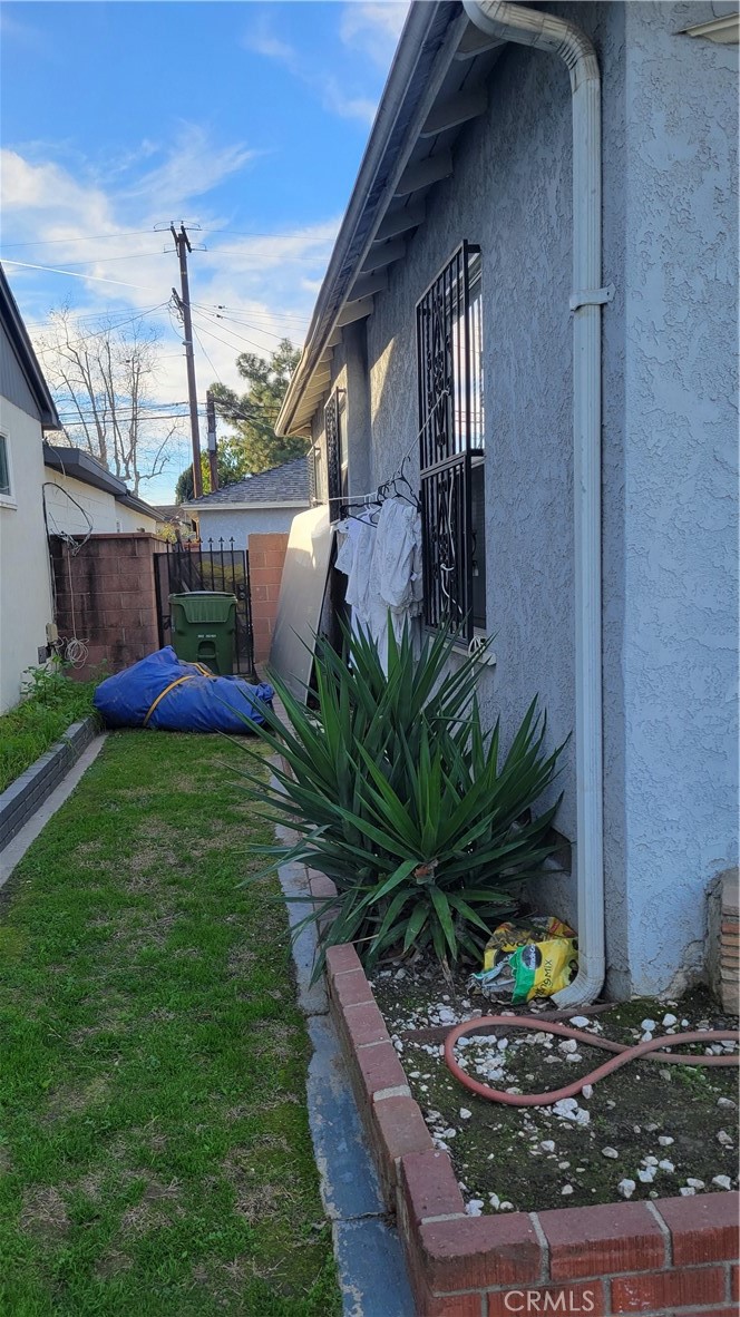 14807 South White Avenue Compton, CA 90221 - Photo 5 of 5 a front view of a house with garden