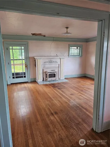 a view of a field with a tree
