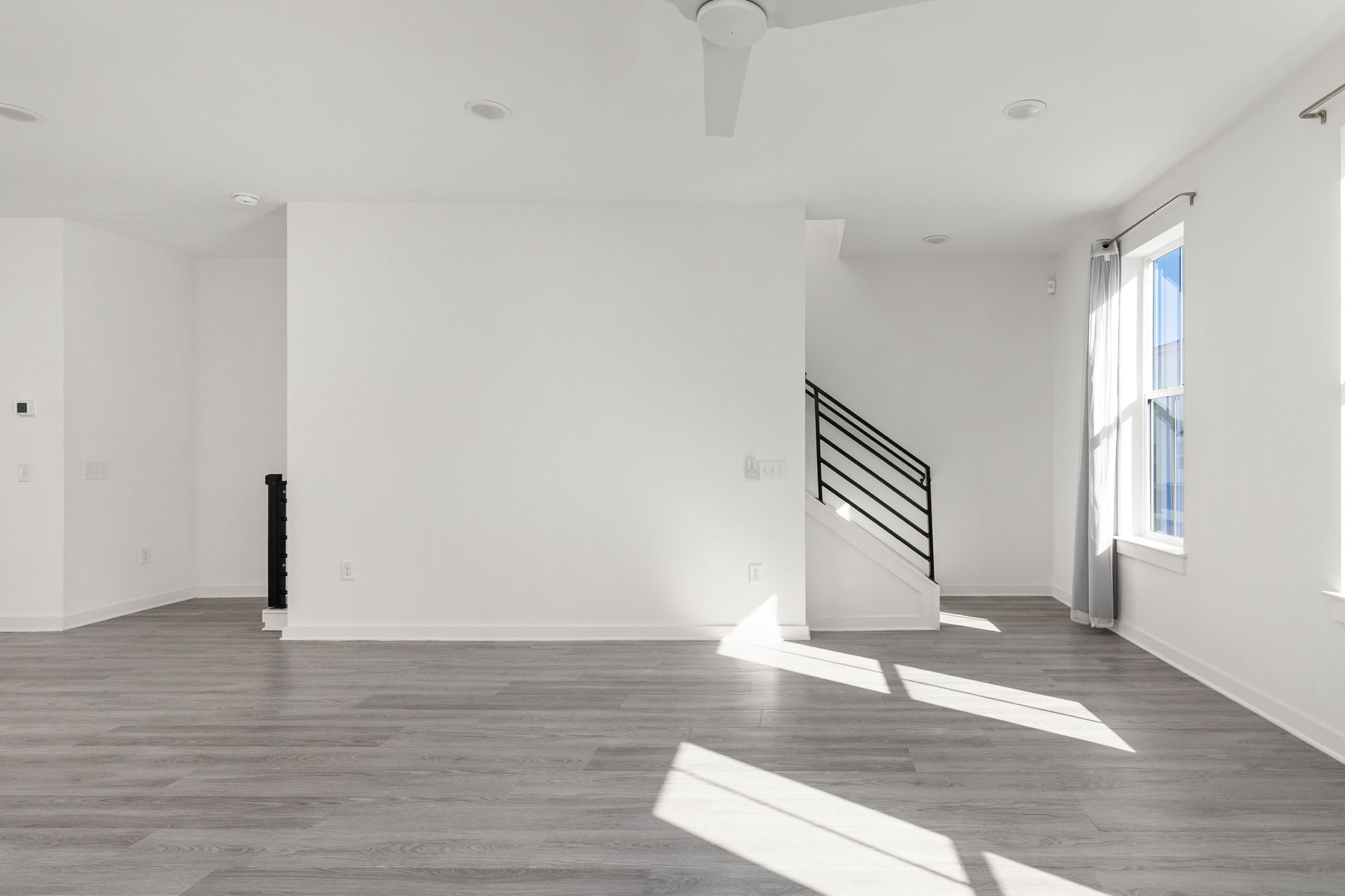 2624 Metcalfe Road, Unit 17 Austin, TX 78741 - Photo 15 of 35 a view of an empty room with wooden floor and a window