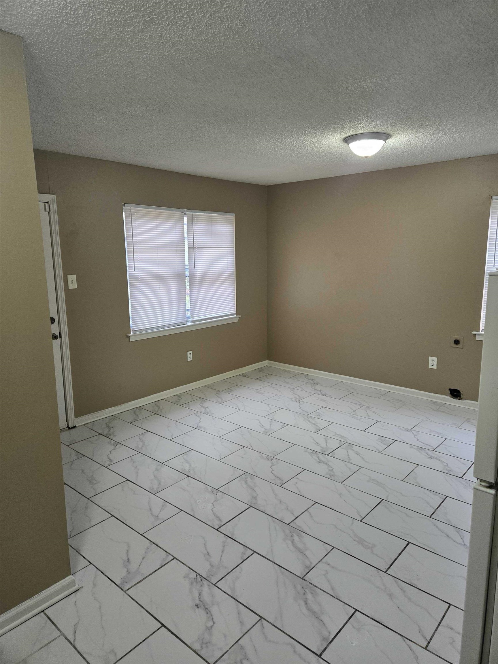 4511 Sumners Wells Road Memphis, TN 38118 - Photo 8 of 8 a view of empty room with window