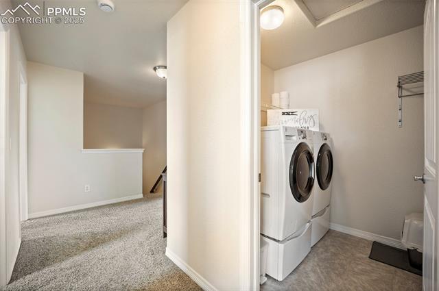 7148 Red Cardinal Loop Colorado Springs, CO 80908 - Photo 40 of 50 Laundry area with independent washer and dryer, baseboards, and carpet flooring