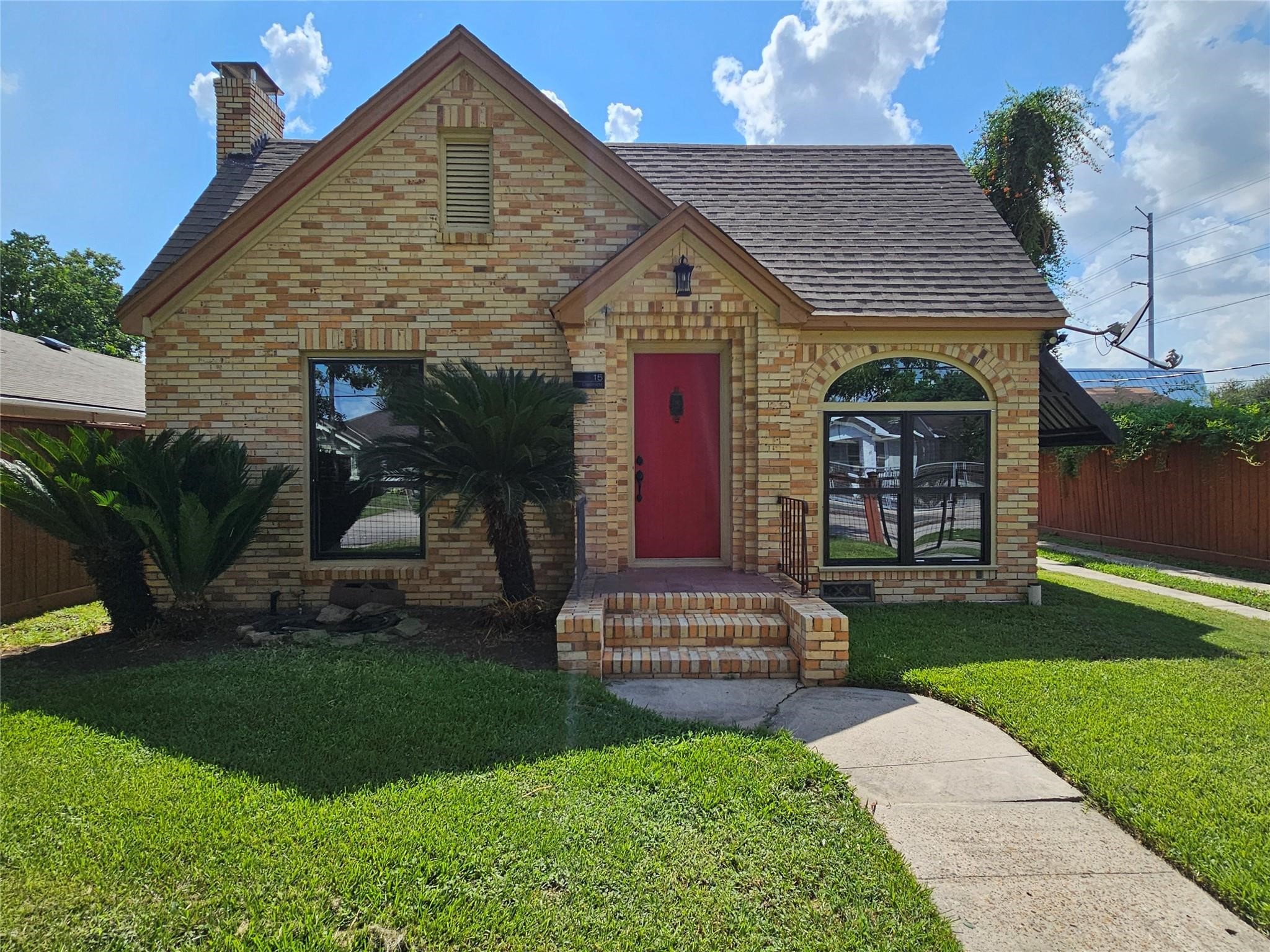 a front view of a house with garden