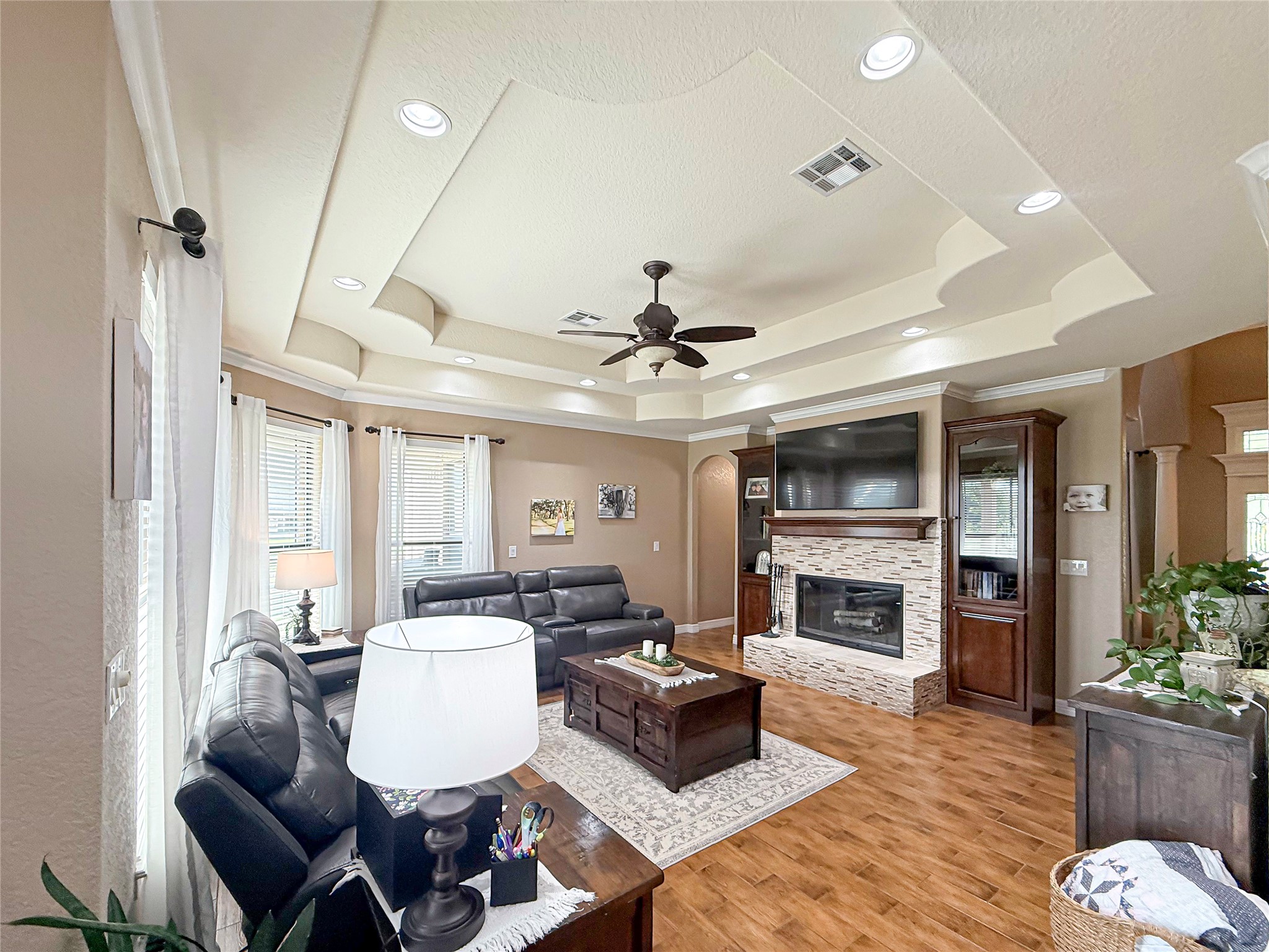 807 Mill Road Angleton, TX 77515 - Photo 2 of 46 Spacious living room featuring elegant recessed ceiling details.