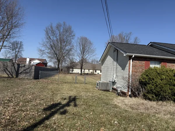 a backyard of a house with a yard and garage