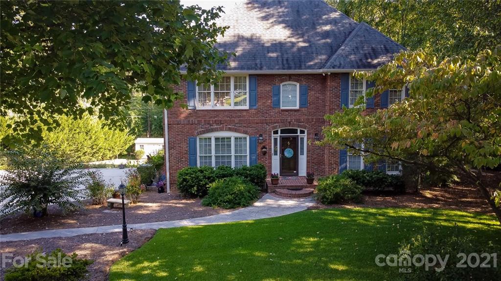 131 Friendfield Drive Fort Mill, SC 29715 - Photo 1 of 46 a front view of a house with a garden