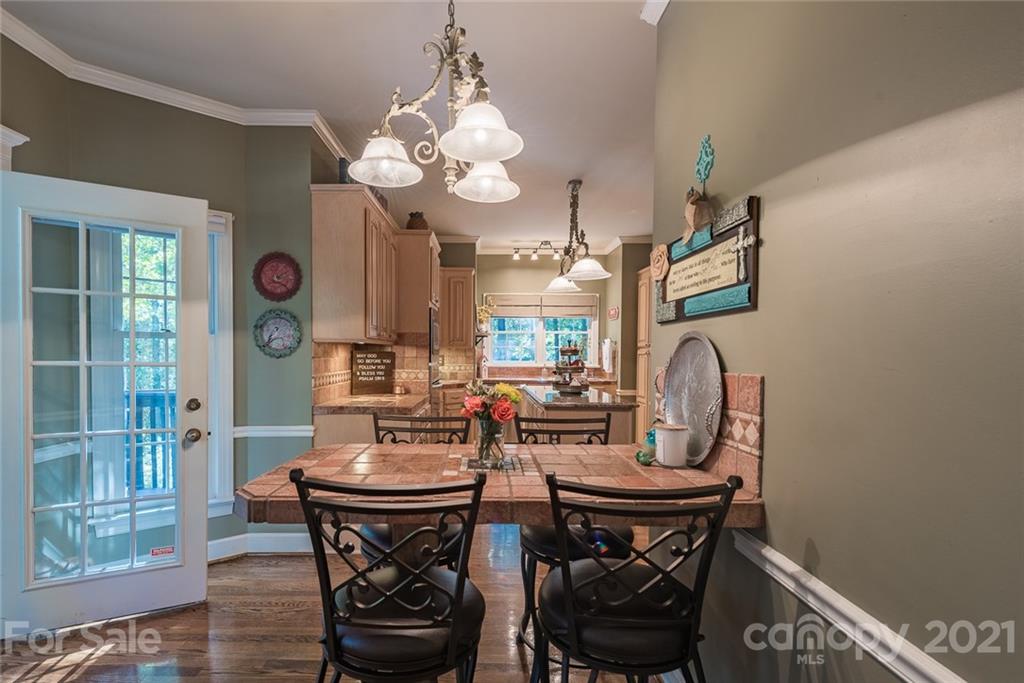 131 Friendfield Drive Fort Mill, SC 29715 - Photo 11 of 46 a view of a dining room with furniture and chandelier