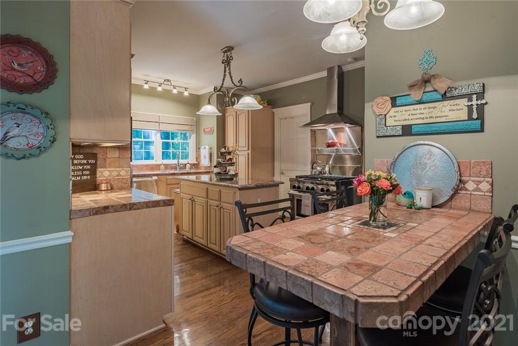131 Friendfield Drive Fort Mill, SC 29715 - Photo 12 of 46 a kitchen with a table and chairs in it