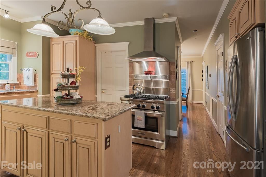 131 Friendfield Drive Fort Mill, SC 29715 - Photo 13 of 46 a kitchen with stainless steel appliances granite countertop a stove a sink and a refrigerator