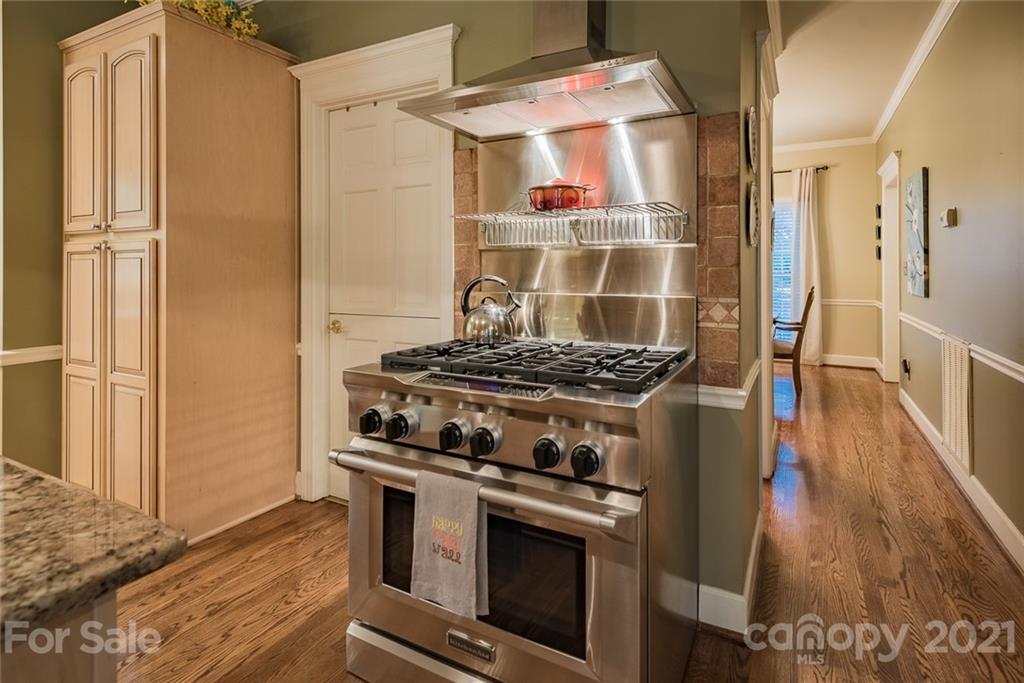 131 Friendfield Drive Fort Mill, SC 29715 - Photo 14 of 46 a kitchen with wooden floor and a stove top oven