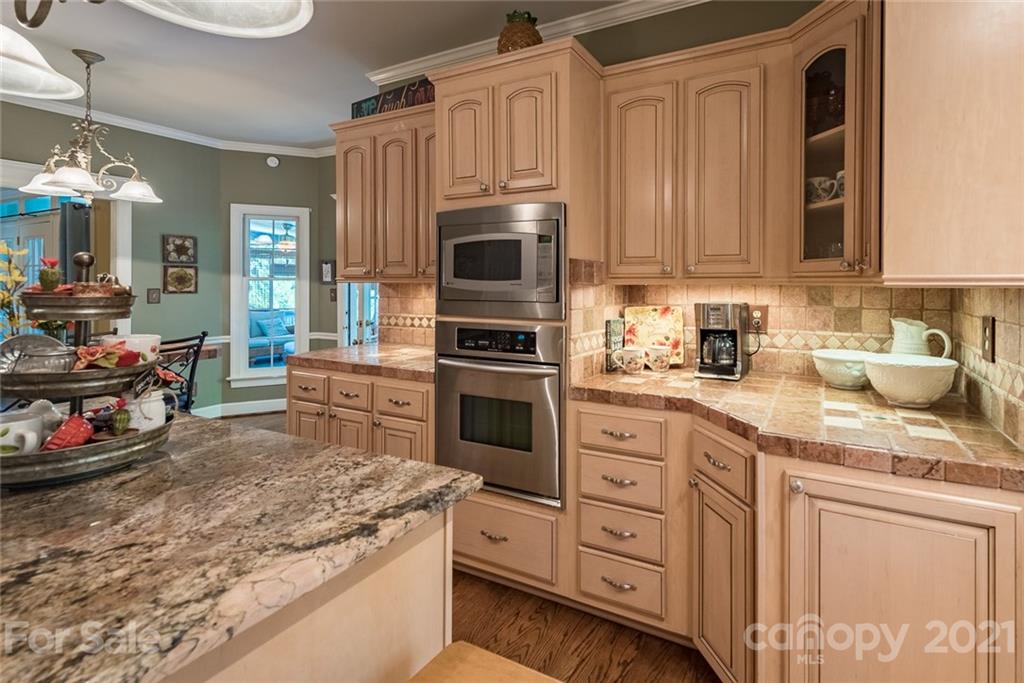 131 Friendfield Drive Fort Mill, SC 29715 - Photo 17 of 46 a kitchen with granite countertop a stove and cabinets