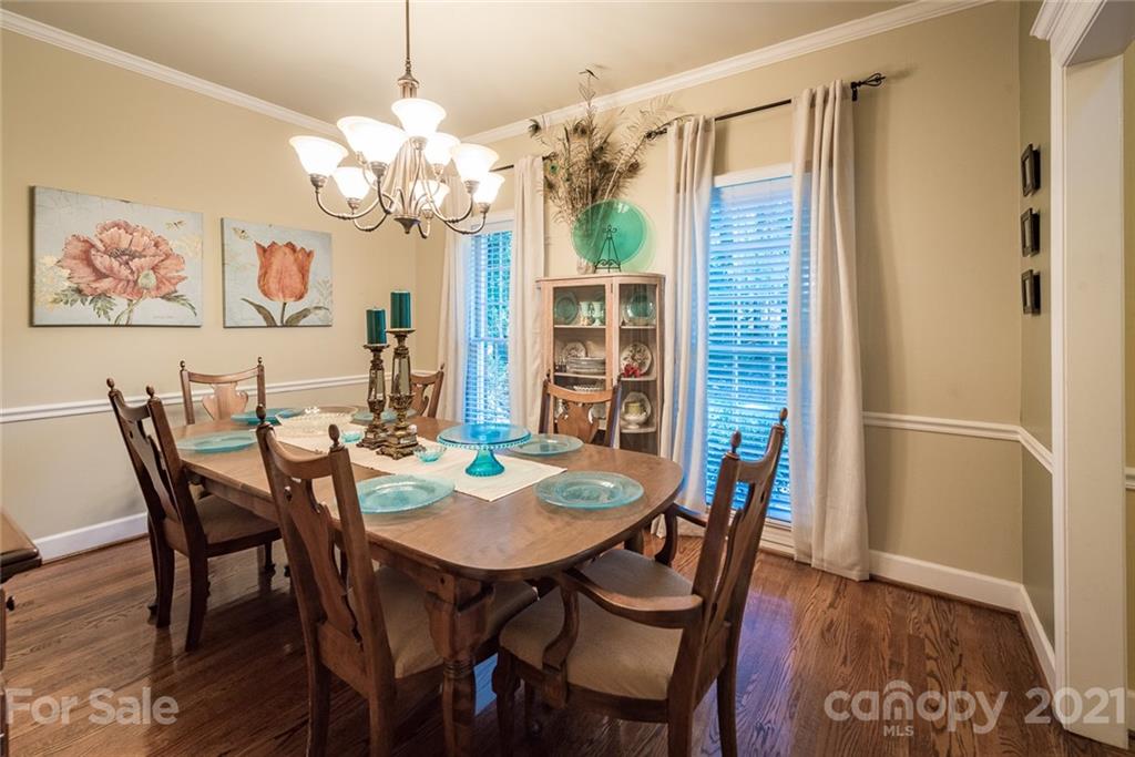 131 Friendfield Drive Fort Mill, SC 29715 - Photo 18 of 46 a view of a dining room with furniture and wooden floor