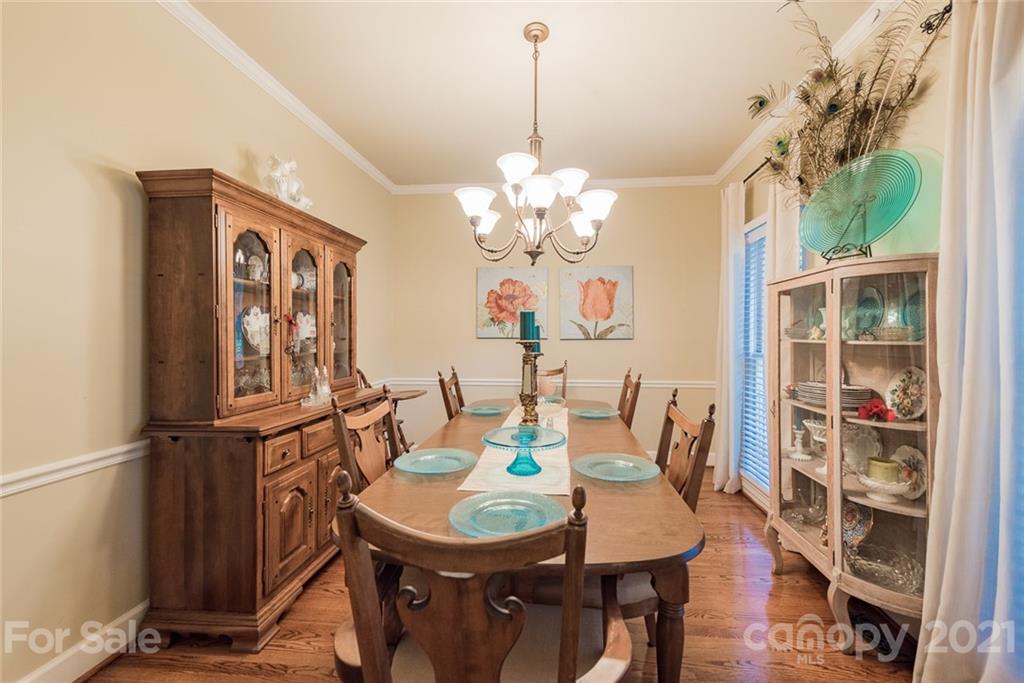 131 Friendfield Drive Fort Mill, SC 29715 - Photo 19 of 46 a view of a dining room with furniture and a chandelier
