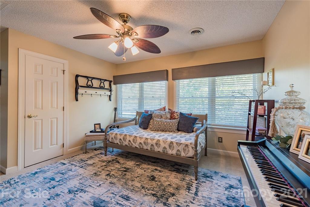 131 Friendfield Drive Fort Mill, SC 29715 - Photo 26 of 46 a bedroom with a bed and a piano