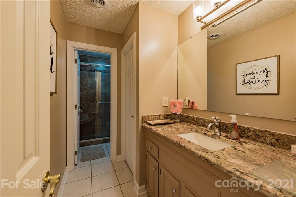 131 Friendfield Drive Fort Mill, SC 29715 - Photo 28 of 46 a bathroom with a granite countertop sink and a mirror