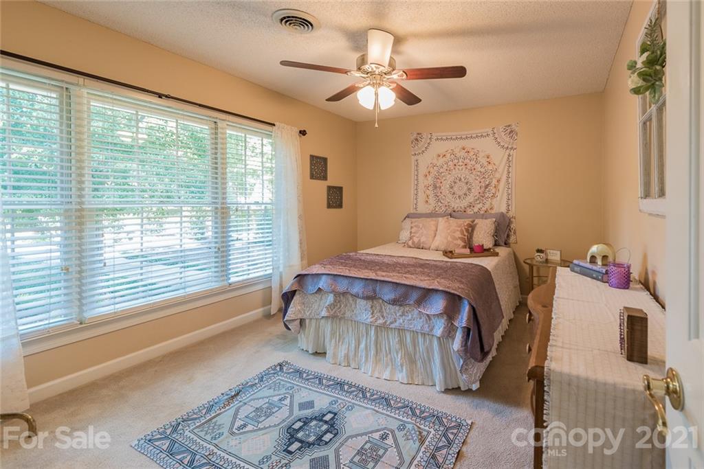 131 Friendfield Drive Fort Mill, SC 29715 - Photo 30 of 46 a bedroom with a large bed and a window