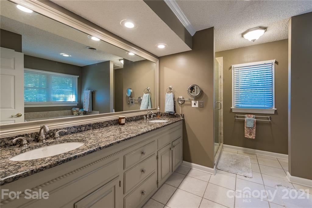 131 Friendfield Drive Fort Mill, SC 29715 - Photo 33 of 46 a bathroom with a granite countertop sink and a mirror