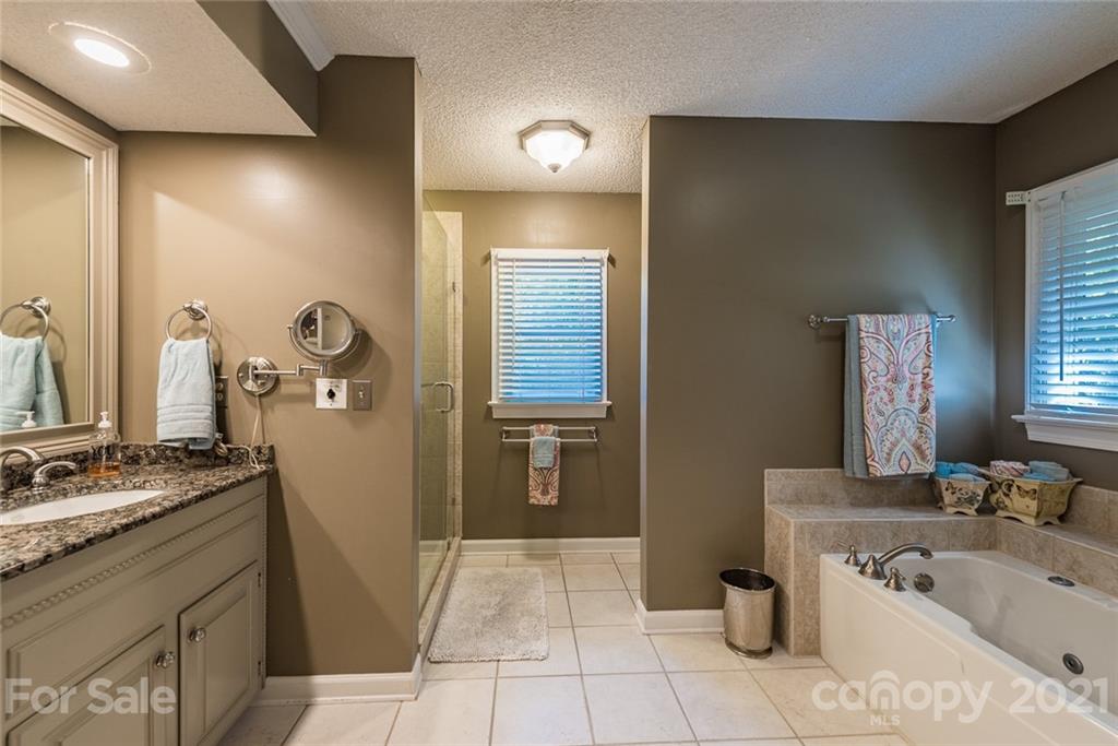 131 Friendfield Drive Fort Mill, SC 29715 - Photo 34 of 46 a bathroom with a sink a toilet and mirror