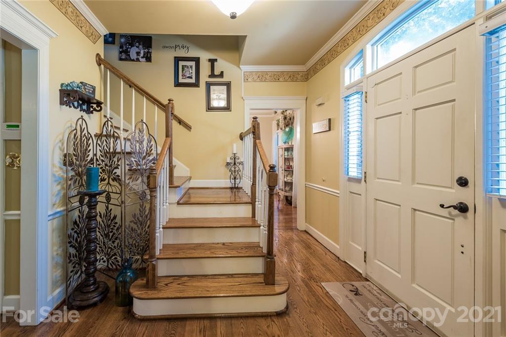 131 Friendfield Drive Fort Mill, SC 29715 - Photo 5 of 46 a view of entryway and hall with wooden floor