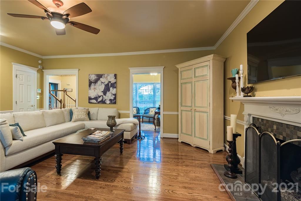131 Friendfield Drive Fort Mill, SC 29715 - Photo 9 of 46 a living room with fireplace furniture and a flat screen tv