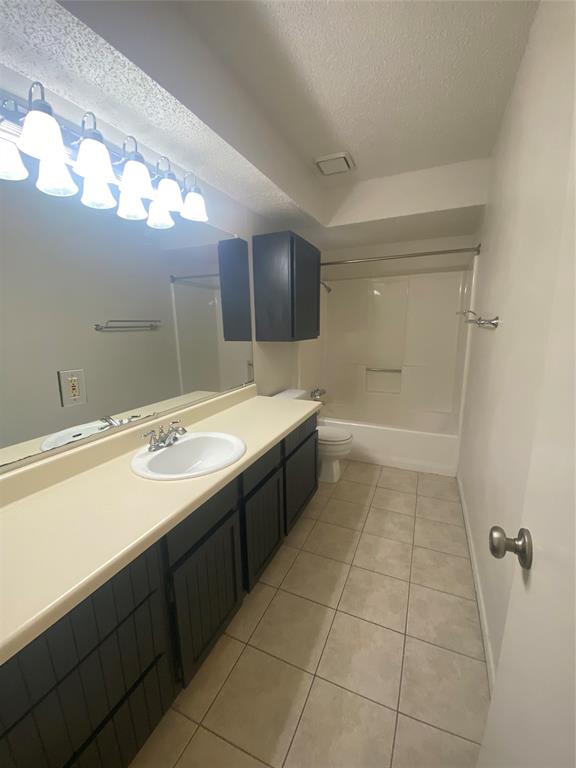 400 South 2nd Street Wylie, TX 75098 - Photo 12 of 22 a bathroom with a sink a toilet a mirror and vanity