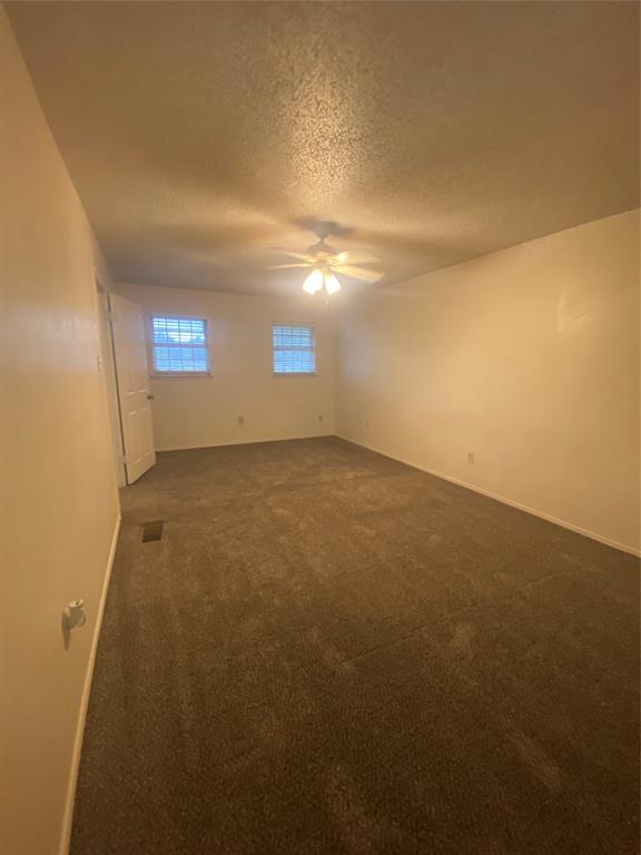 400 South 2nd Street Wylie, TX 75098 - Photo 13 of 22 Large primary bedroom upstairs with ceiling fan and walk-in closet