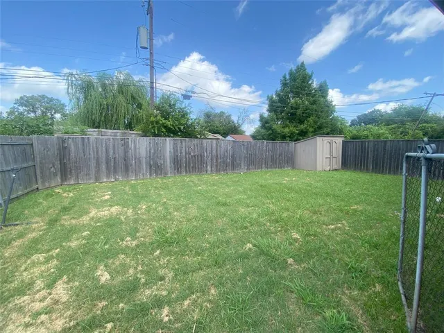 a view of a backyard with a plants and trees