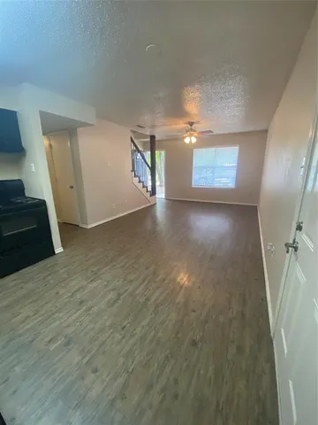 a view of a hallway with a window