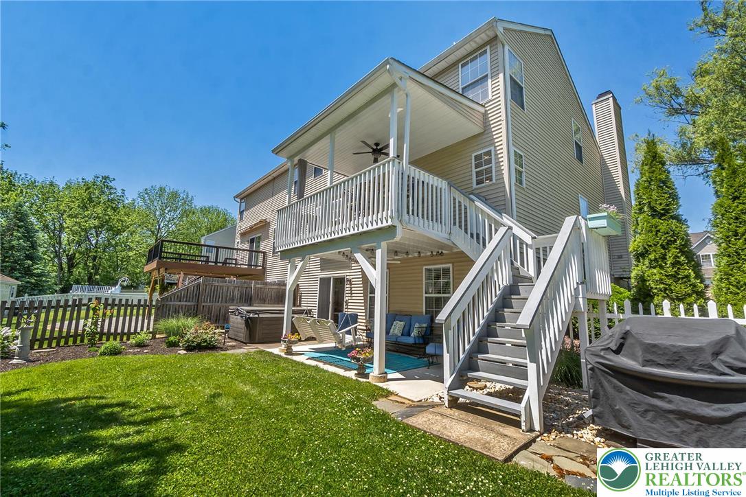 2314 Red Maple Drive Coplay, PA 18037 - Photo 61 of 73 A multi-level outdoor living space features both a covered patio and an elevated deck, perfect for entertaining.