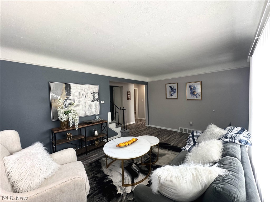 2440 Dentzler Road Parma, OH 44134 - Photo 2 of 11 Living area featuring wood finished floors and stairway