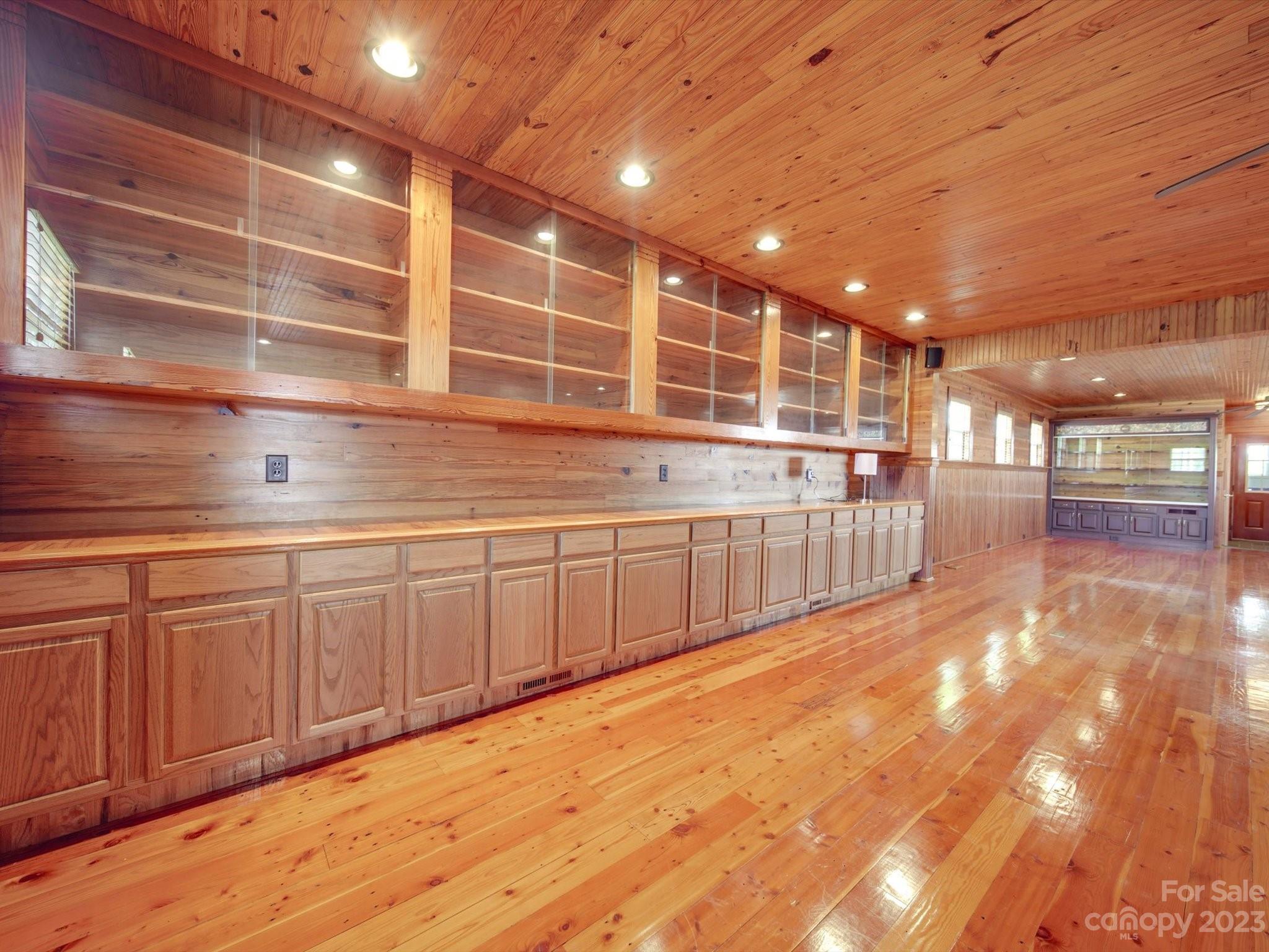 1004 Austin Chaney Road Wingate, NC 28174 - Photo 13 of 48 a view of an empty room with wooden floor and a window