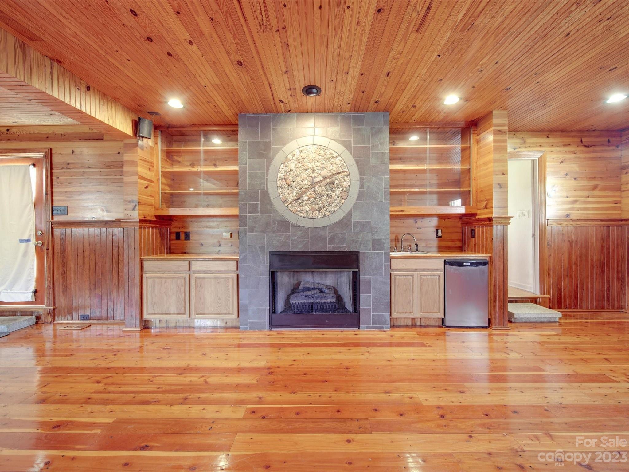 1004 Austin Chaney Road Wingate, NC 28174 - Photo 14 of 48 a living room with fireplace furniture and a wooden floor