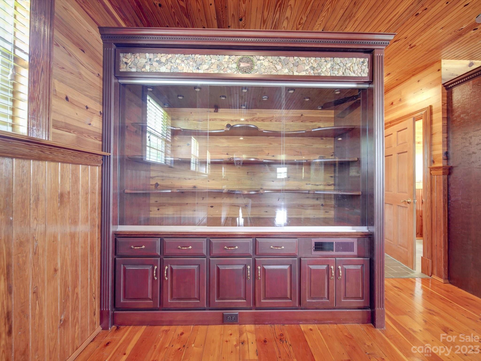 1004 Austin Chaney Road Wingate, NC 28174 - Photo 18 of 48 a view of a kitchen with wooden floor and cabinets