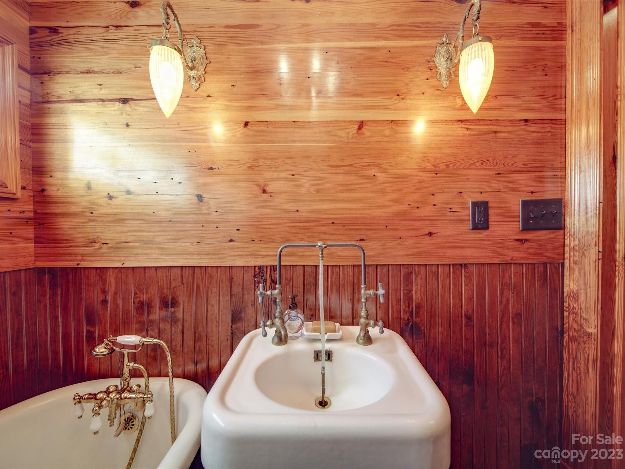 1004 Austin Chaney Road Wingate, NC 28174 - Photo 21 of 48 a bathroom with a sink and a large mirror