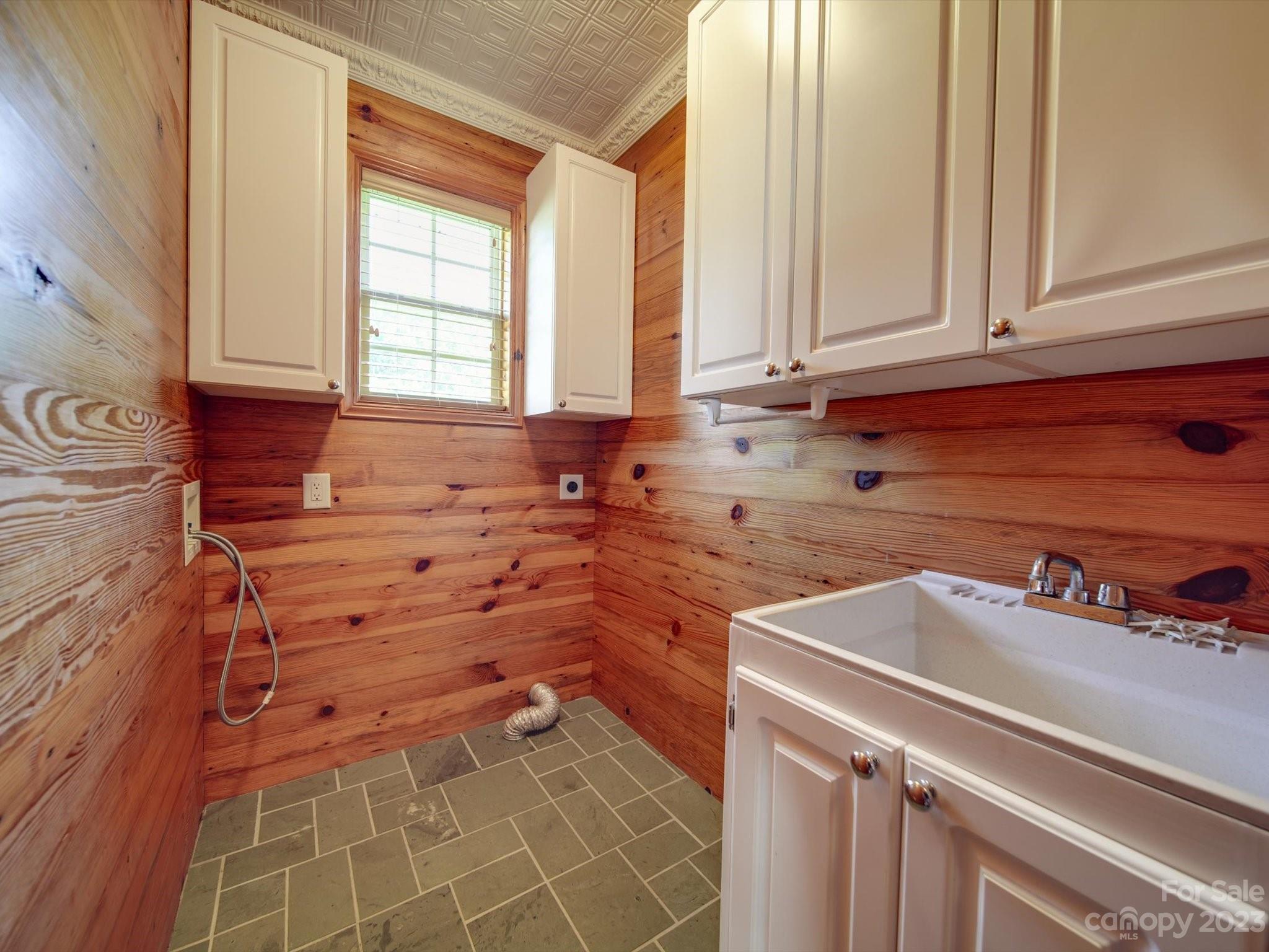 1004 Austin Chaney Road Wingate, NC 28174 - Photo 22 of 48 a kitchen with a sink and cabinets