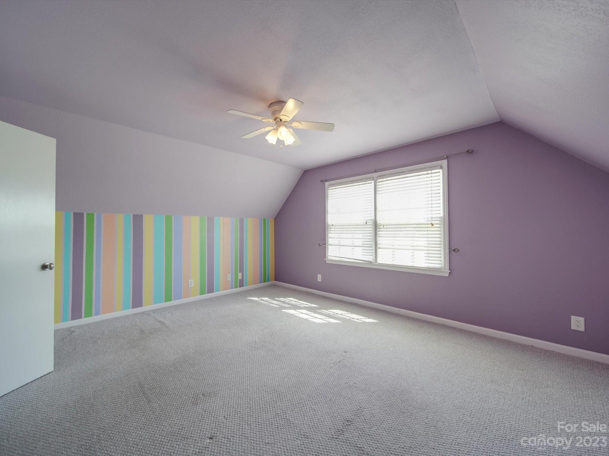 1004 Austin Chaney Road Wingate, NC 28174 - Photo 35 of 48 an empty room with windows and ceiling fan