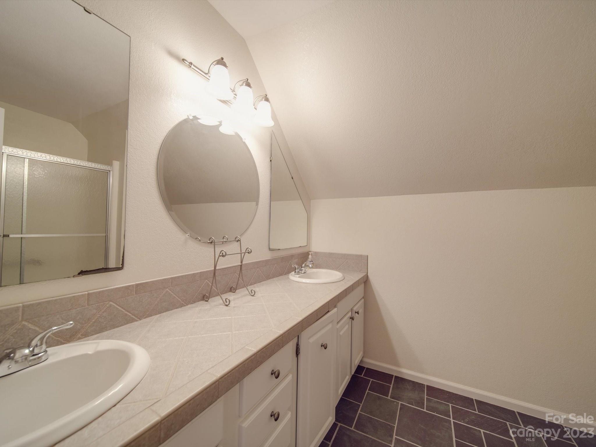 1004 Austin Chaney Road Wingate, NC 28174 - Photo 38 of 48 a bathroom with a sink and a mirror