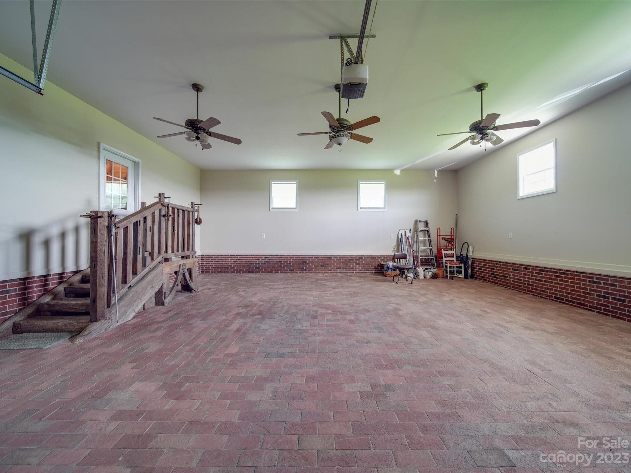 1004 Austin Chaney Road Wingate, NC 28174 - Photo 44 of 48 an empty room with windows and ceiling fan