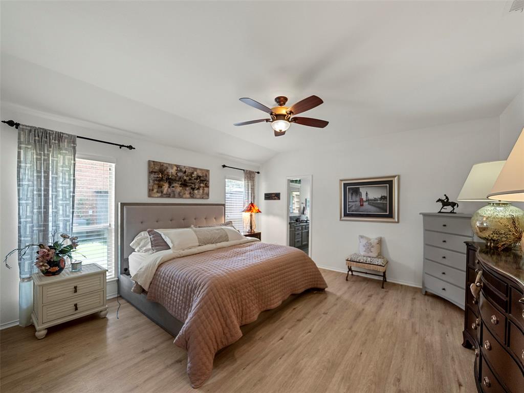 204 Arbor Ridge Drive Allen, TX 75002 - Photo 15 of 36 Spacious room with wood-finish flooring, vaulted ceiling, and a ceiling fan with integrated lighting