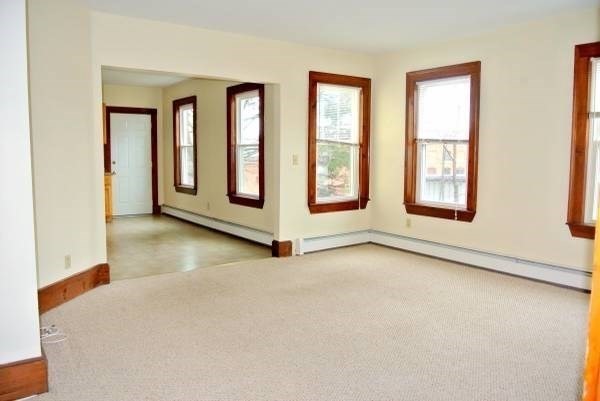 21 Maple Street Clinton, MA 01510 - Photo 11 of 17 an empty room with windows