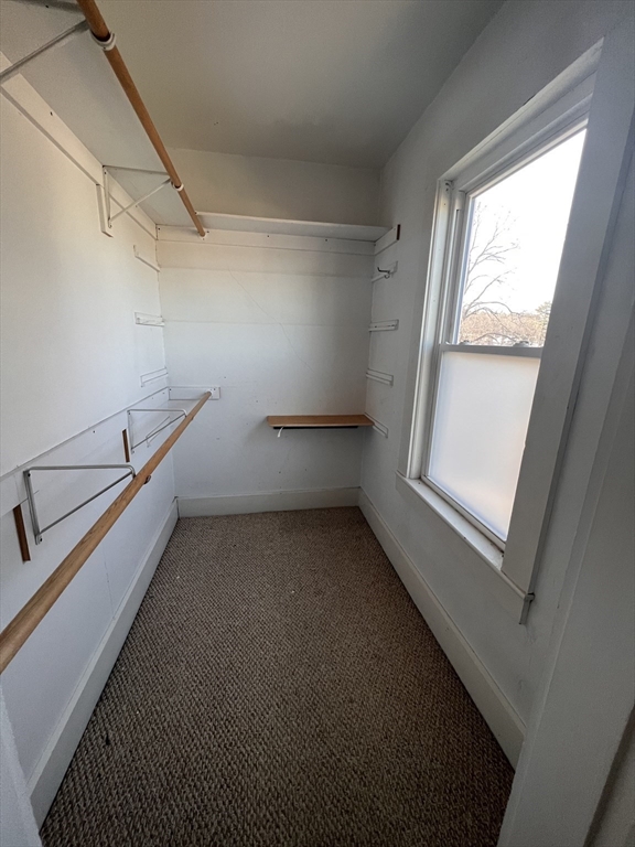 21 Maple Street Clinton, MA 01510 - Photo 15 of 17 a view of a room with racks on the wall