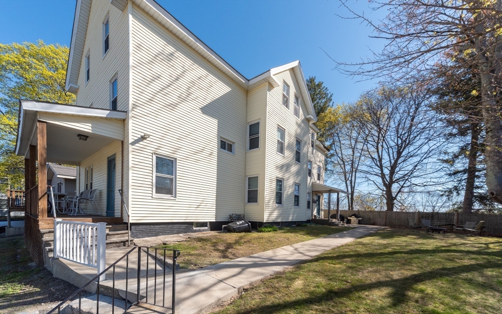 21 Maple Street Clinton, MA 01510 - Photo 3 of 17 a view of back yard of the house