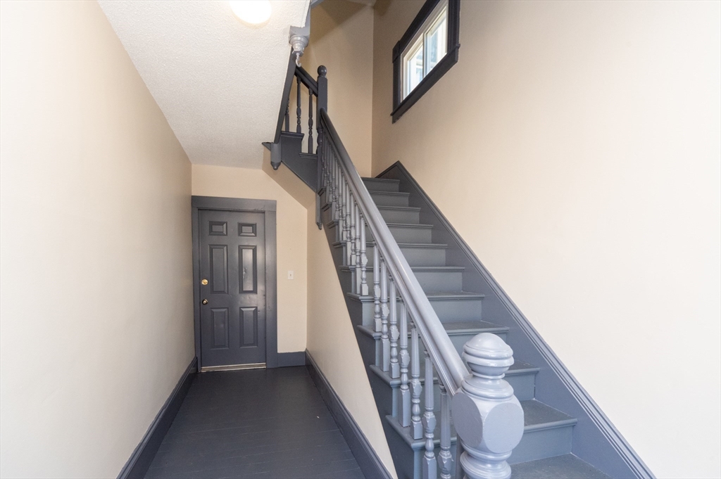 21 Maple Street Clinton, MA 01510 - Photo 5 of 17 a view of a hallway with staircase