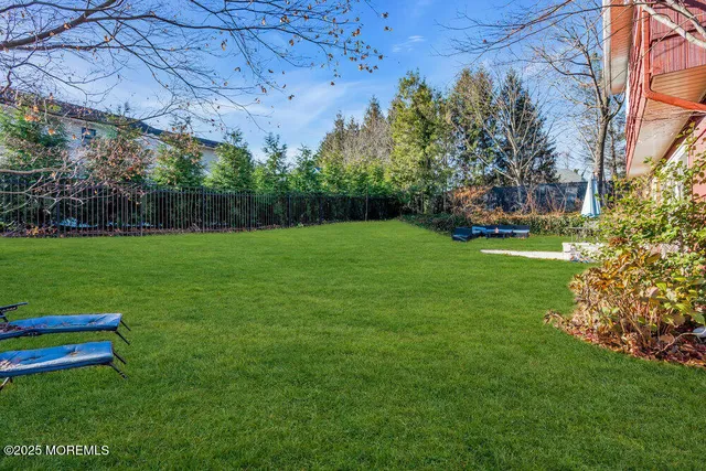 a view of a park with large trees