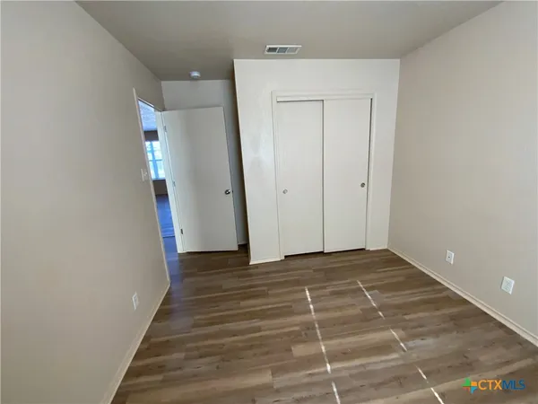 a view of a hallway with closet