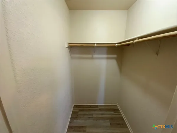 a view of an empty walk in closet