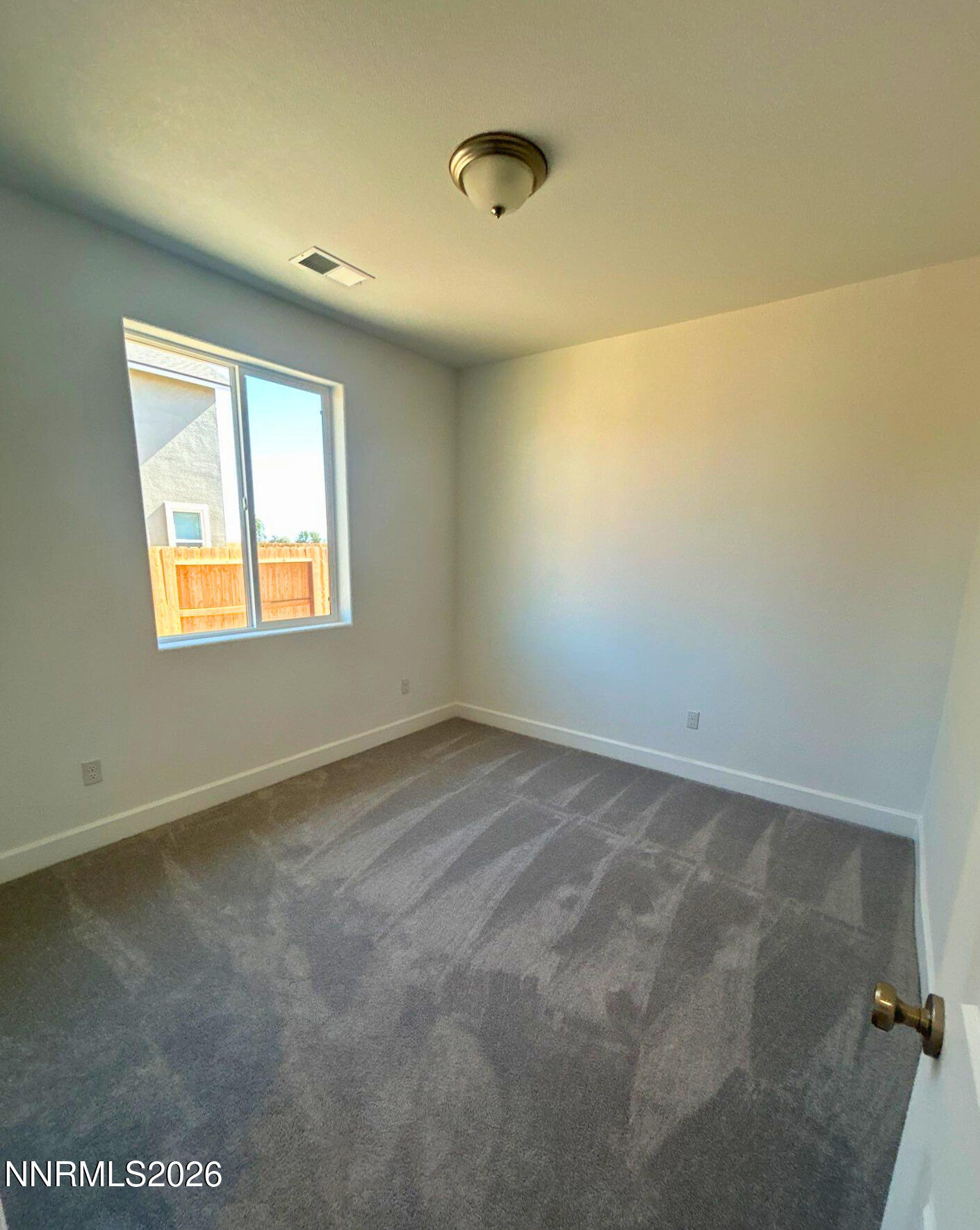 3453 Payton Way Fernley, NV 89408 - Photo 13 of 15 a view of an empty room with a window