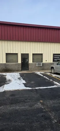 a view of kitchen with granite countertop sink
