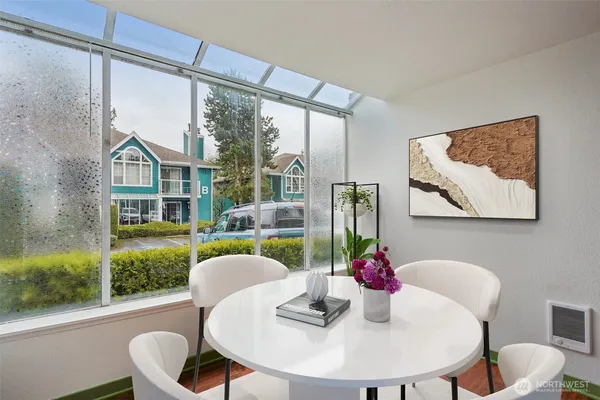 a view of a dining room with furniture window and outside view